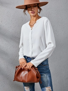 Elegant white long sleeve blouse with scalloped V-neck trim and button-down front