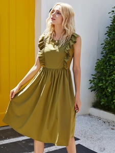 Detail of olive green sleeveless dress featuring ruffled shoulders and pleated waist