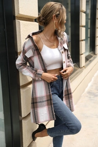 Elegant pink and brown plaid long sleeve dress with white top and slim blue jeans outfit
