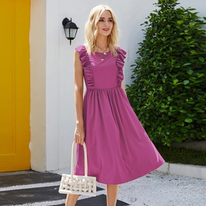 Detail of purple sleeveless dress featuring elegant ruffle trim and elastic waist detail
