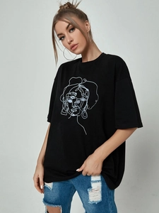 Detail of oversized black cotton T-shirt featuring an abstract white face line print