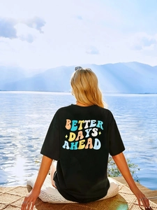 Women's black loose cotton T-shirt featuring 'BETTER DAYS AHEAD' back graphic print
