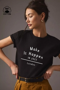Detail of black cotton T-shirt featuring white 'Make It Happen' letter print and soft fabric