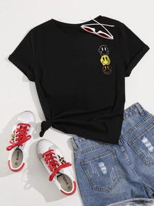Black cotton t-shirt with melting smiley print and knotted hem detail on white background