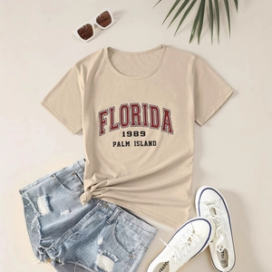 Women's casual khaki T-shirt with Florida print and denim shorts flat lay summer set