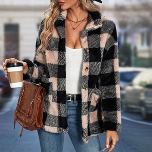 Close-up of pink and black plaid flannel jacket with soft plush texture and collar detail