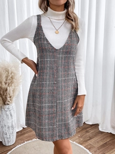 Detail of plaid V-neck pinafore dress with high collar knit sweater two-piece outfit