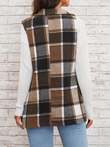 Women's autumn plaid tweed suit vest with lapel and buttons on a casual white top