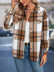 Detail of brown plaid shacket featuring front flap pockets and button-down front