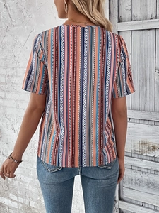 Back view of a bohemian geometric striped V-neck short sleeve blouse on a model
