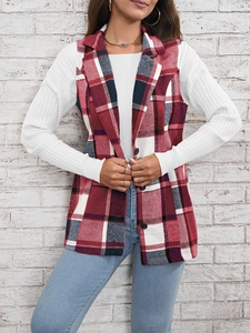 Detail of red and white plaid vest jacket featuring a notched lapel and button closure