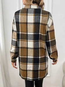 Women's oversized brown plaid shacket featuring long sleeves and button-down front