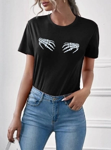 Women's black crew neck T-shirt with skeleton hands print paired with high waist jeans