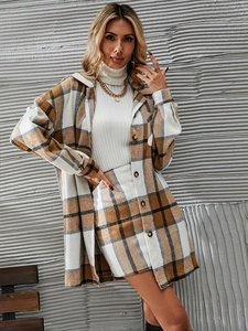 Close-up of brown plaid wool jacket and high-waisted mini skirt set with buttons