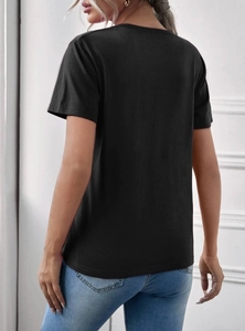 Women's black crew neck t-shirt with skull hand print on back and blue slim jeans