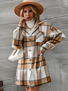 Detail of classic plaid pattern fabric on a thick long-sleeve jacket with breast pocket