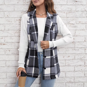 Women's plaid vest with lapel collar in black and white check pattern, styled with jeans