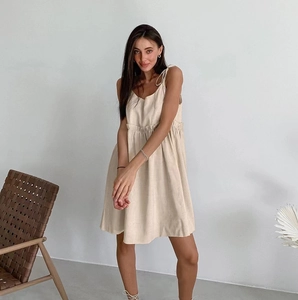 Beige sleeveless cotton linen maxi dress with spaghetti straps for summer vacations