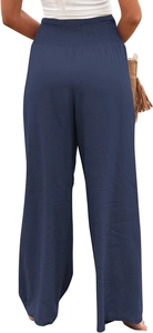 Detail of high waist elastic waistband on dark blue wide leg trousers with pleated texture