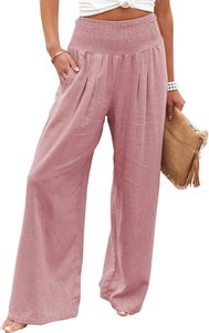 Detail of high waist pink wide leg trousers featuring a ruffled elastic waistband and pockets