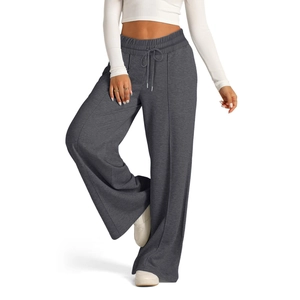 Detail of high-waisted dark grey wide-leg pants with elastic drawstring and vertical seam