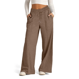 Detail of dark coffee high-waisted wide-leg joggers with drawstring and front seam line