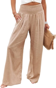 Detail of high waisted wide leg trousers featuring elastic waistband and side pockets