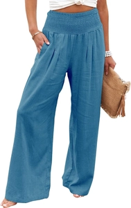 Detail of high-waisted blue wide-leg pants featuring elastic waistband and handy side pockets