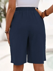 Back view of navy blue cotton linen shorts with elastic high waistband and breathable fabric