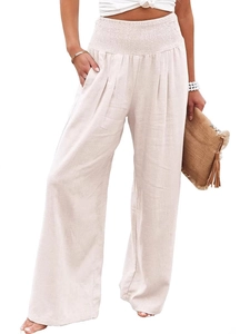 Women's high waisted wide leg pants in beige linen blend with pleated waist and pockets