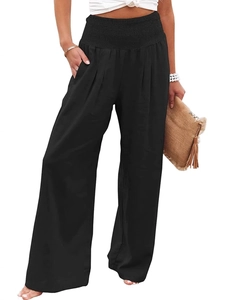 Women's black high waisted wide leg trousers with a smocked waist and side pockets