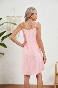 Detail of pink eyelet embroidery fabric and delicate double cross spaghetti straps dress