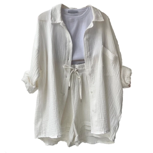 Detail of three-piece loungewear set with white crepe shirt and drawstring shorts