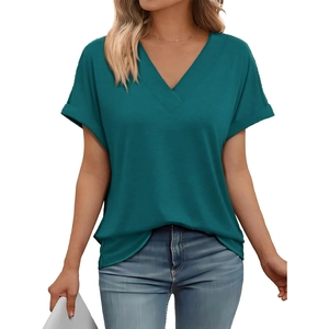 Close-up of deep V-neckline and textured teal fabric on a loose short-sleeve women's tee