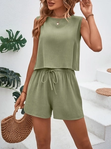 Detailed texture of sage green sleeveless top and drawstring shorts summer set