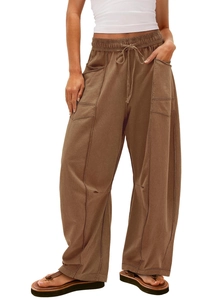 Detail view of brown high-waisted wide-leg cargo pants with drawstring and large pockets
