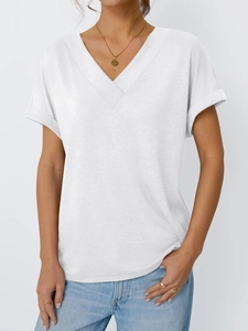 Close-up of white deep V-neck T-shirt showing rolled cuffs and soft cotton texture