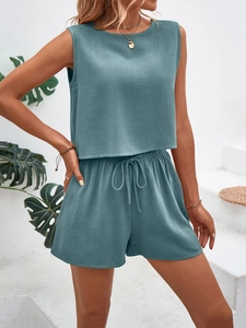 Detail of the waffle textured fabric on a sleeveless blue two-piece summer casual set