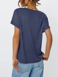 Detail view showing rolled sleeve design and textured navy fabric of the loose summer tee