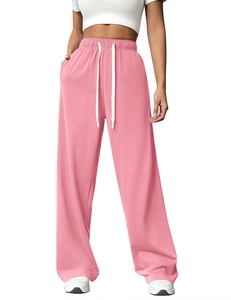 Detail view of pink high-waisted wide-leg sweatpants with adjustable white drawstring
