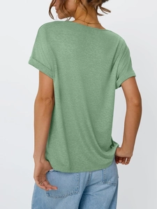 Detail showing the rolled-up sleeve cuffs and sage green knit texture of the women's T-shirt