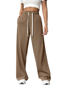 Detail view of coffee-colored high waist sweatpants with white drawstring and wide leg cut