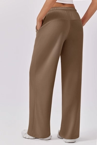 Detailed back side view of high waist wide leg sweatpants with elastic drawstring waistband
