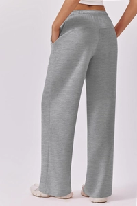 Macro view of elastic waistband and thick heather grey fabric on wide leg trousers