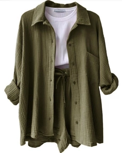 Three-piece muslin set with olive green shirt, drawstring shorts and white ribbed tank top