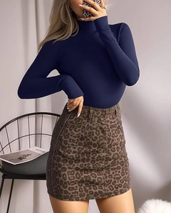 Detail of dark blue high neck long sleeve bodysuit paired with leopard print mini skirt