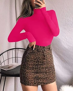 Detailed shot of a hot pink high-neck long-sleeve bodysuit with leopard skirt