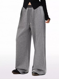 Detail of grey wide leg lounge pants with adjustable drawstring and elastic waistband