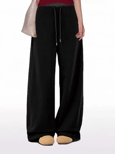 Women's black wide-leg sweatpants with drawstring waist and loose straight-cut fit