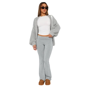 Women's light grey knit cardigan with puff sleeves and matching flare trousers
